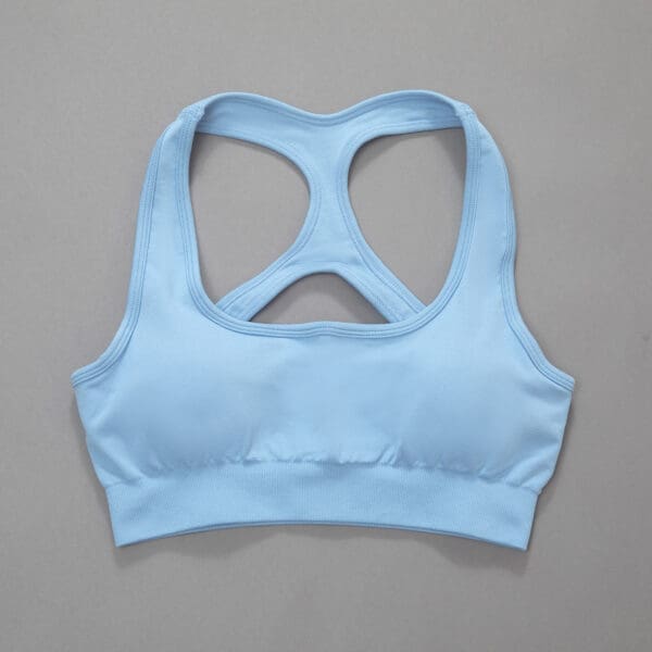 A light blue sports bra with a cut out back.