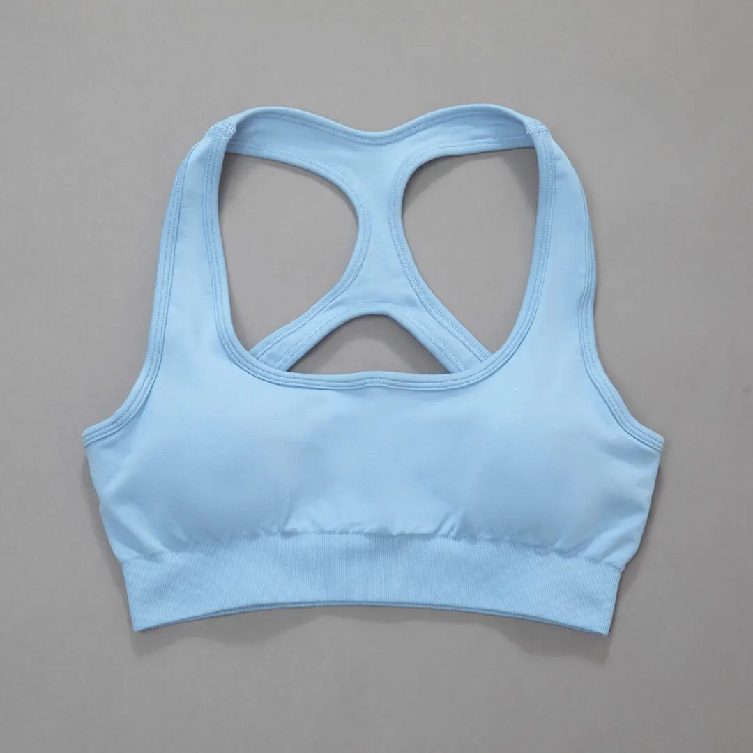 A light blue sports bra with a cut out back.