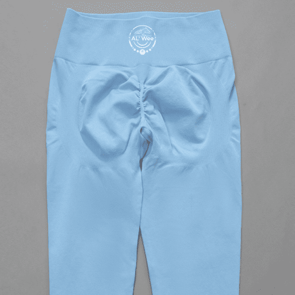 A pair of blue pants with white logo on the back.