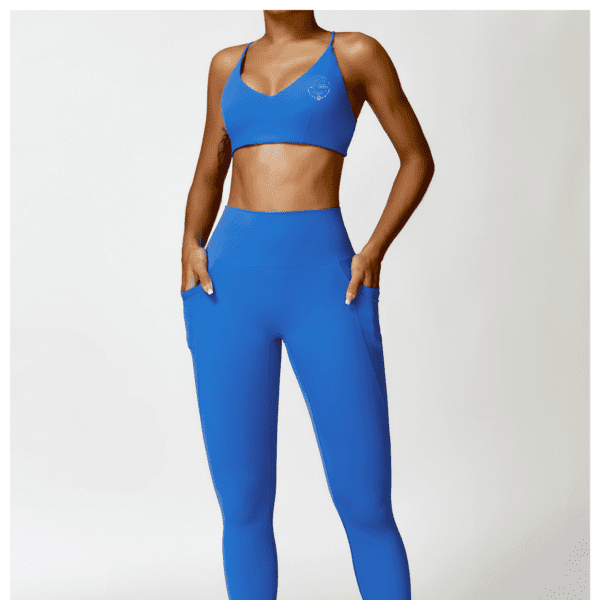 A woman in blue workout clothes posing for the camera.