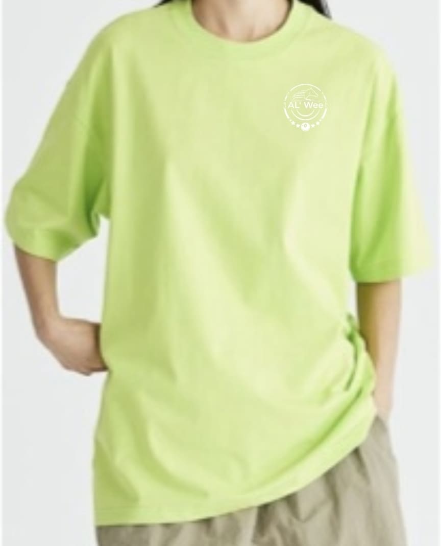 A person wearing a lime green shirt and shorts.