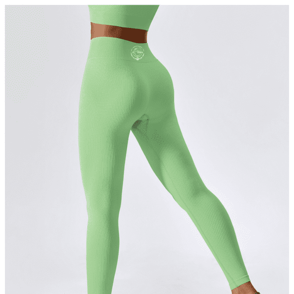 A woman in green pants and a belt